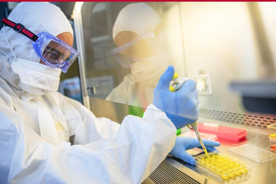 Man in full clean room PPE for biosafety