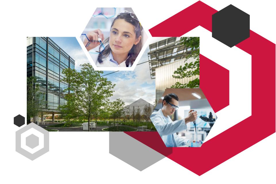 Innovation District buildings with green space, hexagon shapes and people in a lab