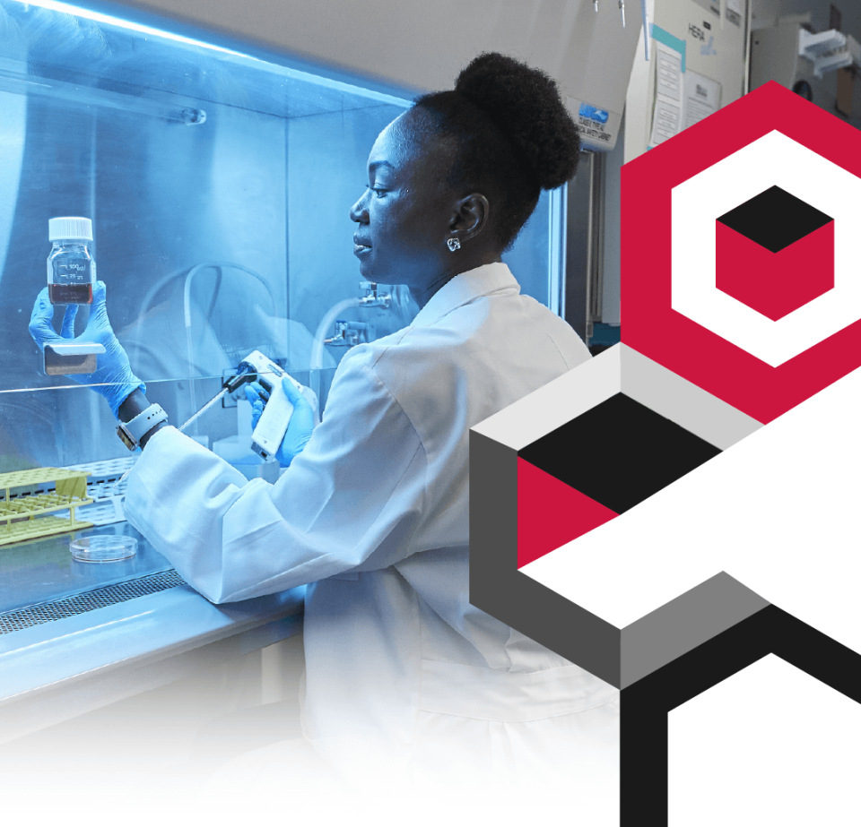 female researcher in clean room in protective equipment for biosafety
