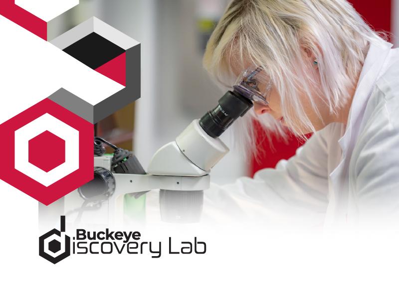 Women looking through a microscope with hexagon graphics and the lab logo
